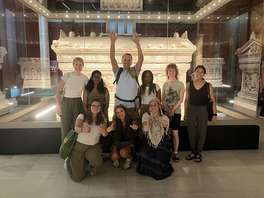 Anton Fedyashin with students in front of Alexander Sarcophagus