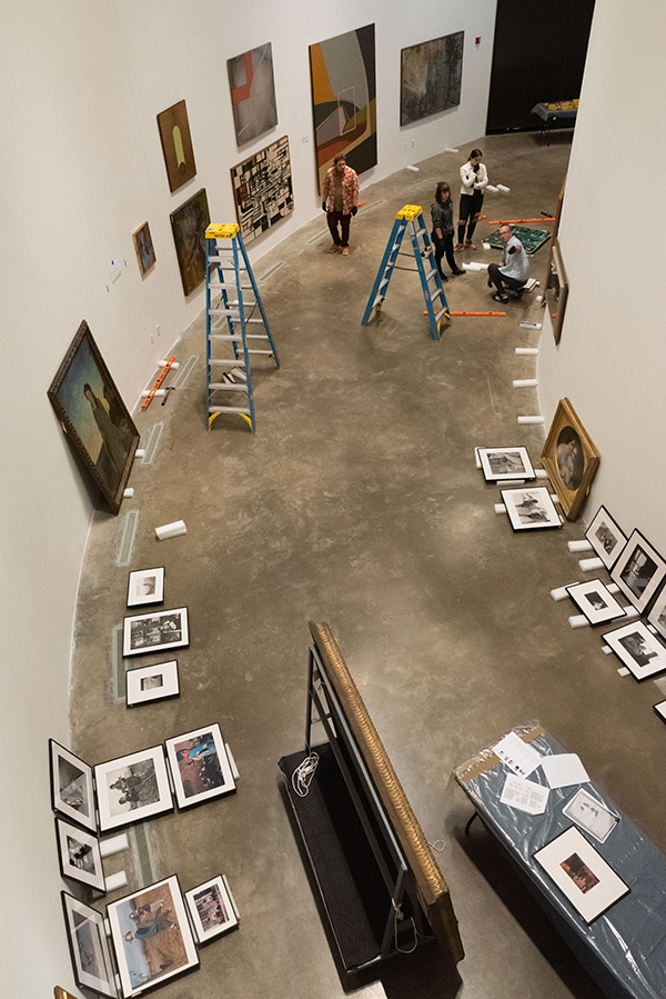 The Moves Like Walter exhibit being installed, seen from overhead