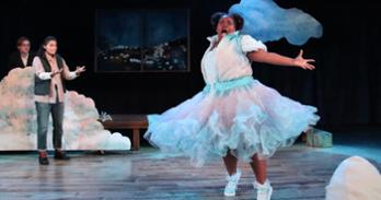 A character dressed as a cloud dances and sings while a character dressed in outdoorsy clothes looks on with confusion, shock, or frustration