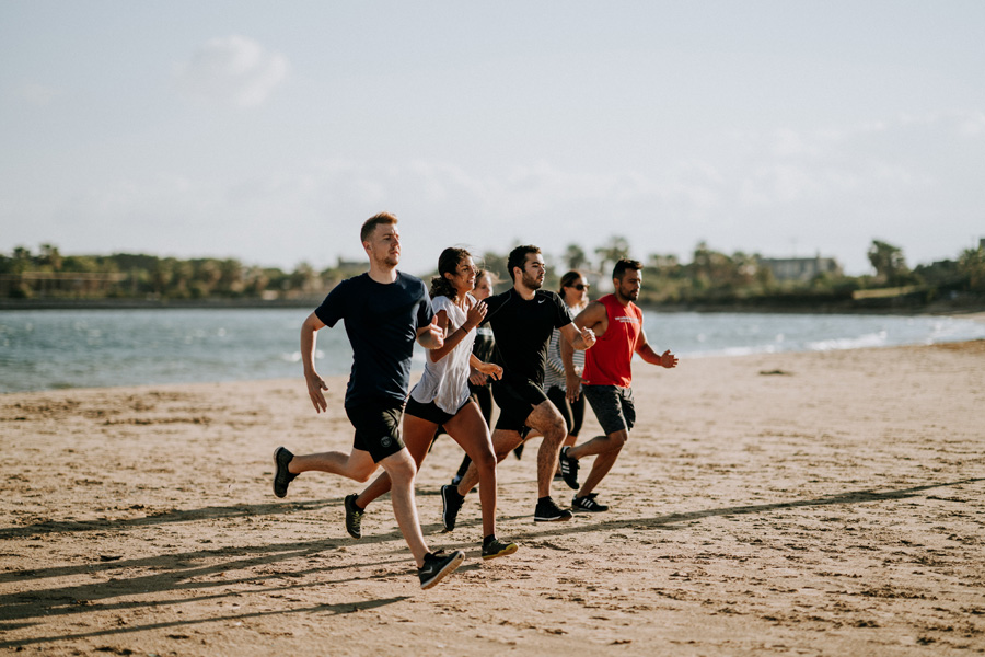 People running on a beach