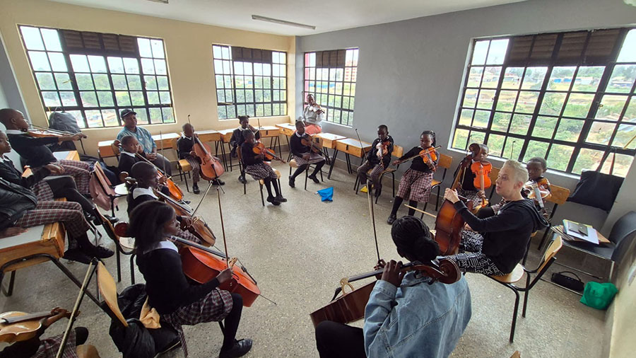 Nancy Jo Snider teaching S’Cool Sounds String students in Kibera, Kenya, in preparation for the National Music Festival 