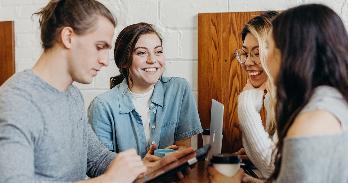 group of people working in coffee shop