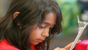 Young Latino girl doing homework