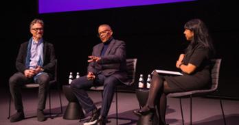 Russell Williams II, SOC/BA ’74, and Barry Josephson, SPA/BA ’78, on stage with SOC Interim Dean Leena Jayaswal at the Academy Museum of Motion Pictures.
