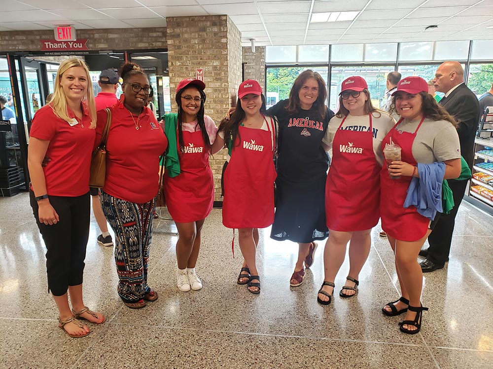 Maria Barry with AU students and staff at WAWA in Tenleytown