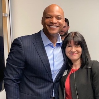 Amy Dacey with Sine Fellow Wes Moore