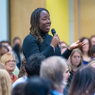 Student speaking at Sine event