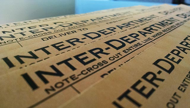 Manila envelopes with the text, "Inter-Departmental Delivery"