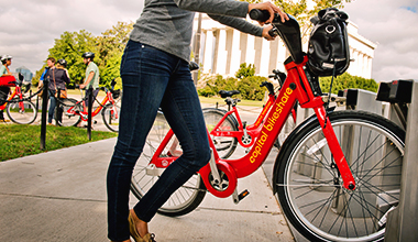 A rider using a Capital Bikeshare bike