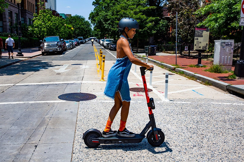 Someone riding a scooter