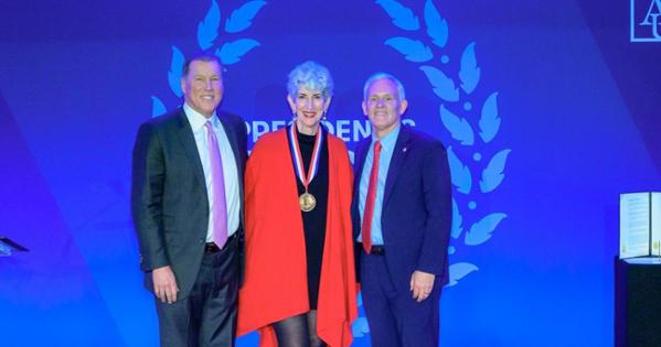 Sharon Wolpoff, President Alger, and Charlie Lydecker stand together for a photo.