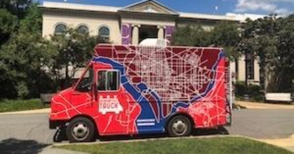 The Humanities Truck in front of Batelle-Tomkins building. There is a map of DC on the truck.