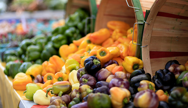 Fresh peppers displayed at a farmers market.