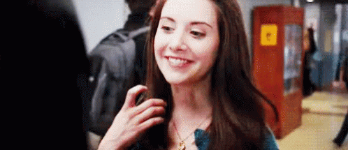 Girl twirling her hair. 