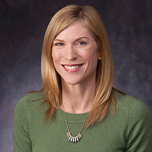 Headshot of Jamie Wyatt wearing a green sweater