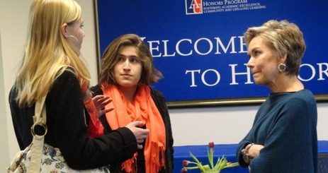 Faculty and students talking at an Honors event