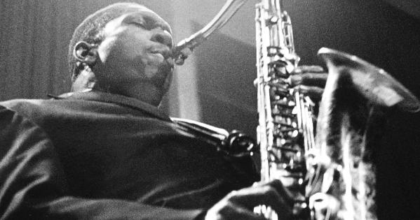 :  John Coltrane, a black man, playing the saxophone