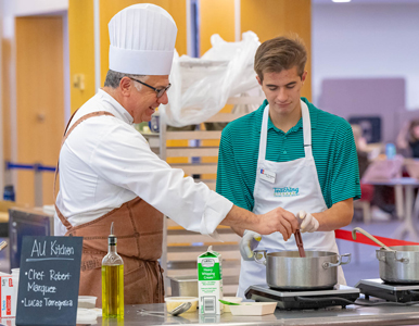 AU Kitchen chef Robert Marquez and student Lucas Torregrosa