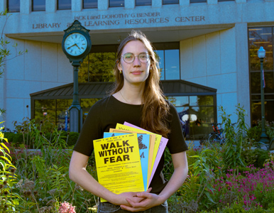 Emma Busch in front of the AU Library