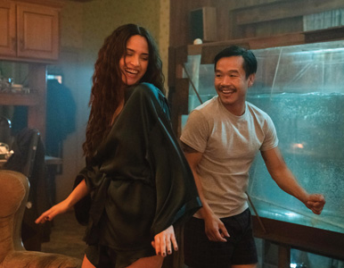 Trieu Tran dances near a fish tank as Sharko in Monsterland