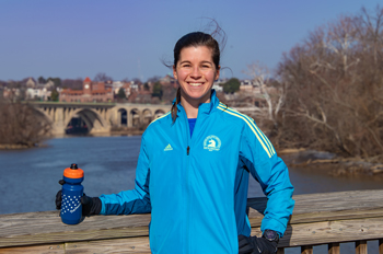 Mara Gramling stands on a bridge to Theodore Roosevelt Island