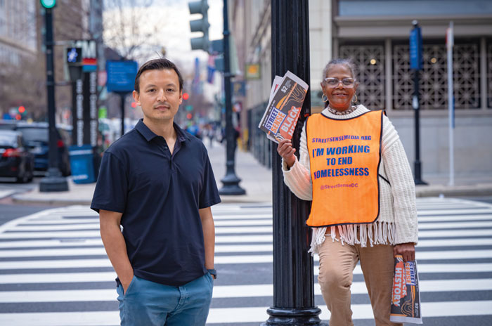 Will Schick and a Street Sense vendor