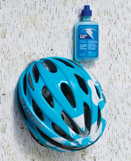 blue bike helmet and bike lube