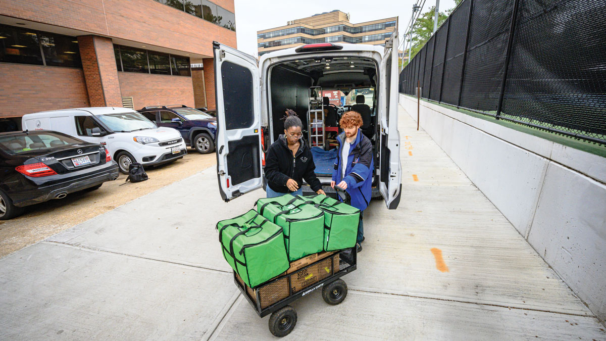 AU students and staff deliver food to a community partner