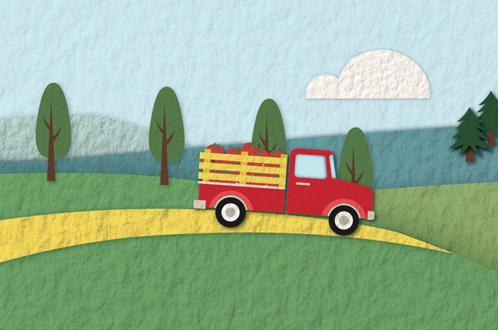 an illustration of a farm truck carrying produce