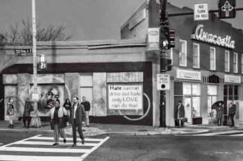 Nine people stand at a corner in Anacostia