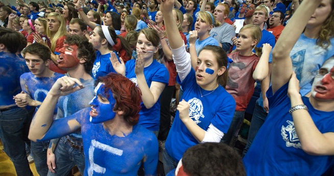 Students join the Blue Crew to cheer the AU Eagles to victory. 