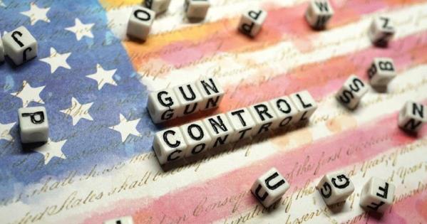 Scrabble letters spell "gun control"