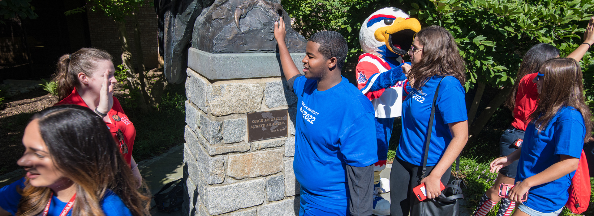 New students rub the talon of the eagle statue for good luck... during commencement, they'll do the same!