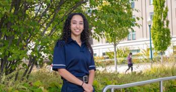 Detective Amanda Kaja, CAS-SPA/BA '13, SPA/MS '16, near the AUPD headquarters on East Campus. Photo by Jeff Watts.
