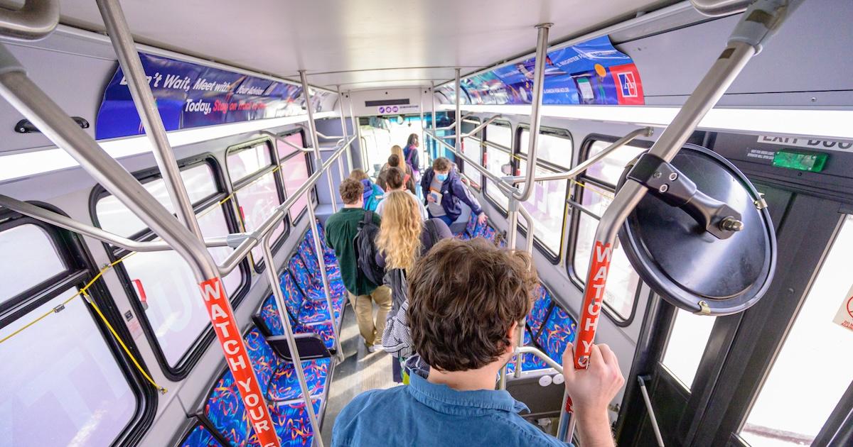 AU riders exit the shuttle bus. Photo by Jeff Watts.