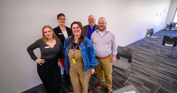 Human books pose for a photo at the Human Library event in Bender Library. Photo by Jeff Watts. 