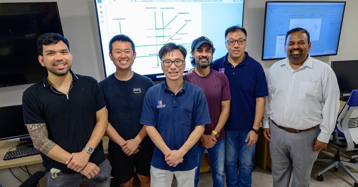The OIT team poses in the Network Operations Center. Photo by Jeff Watts.