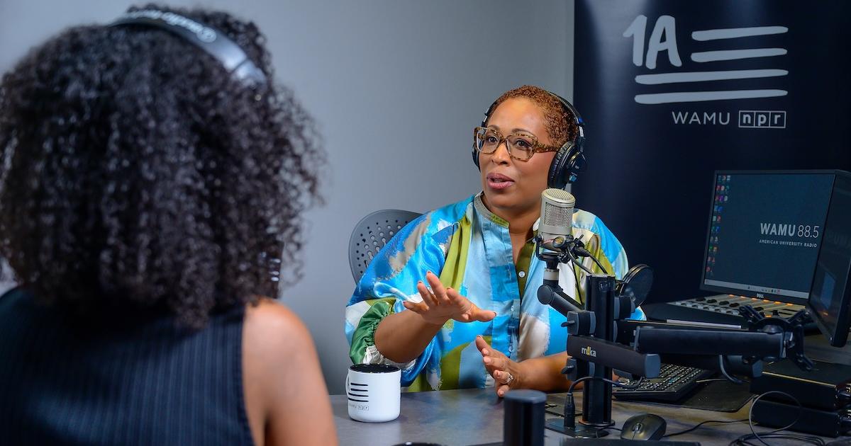 Jenn White engages with a guest in-studio. Photo by Jeff Watts.