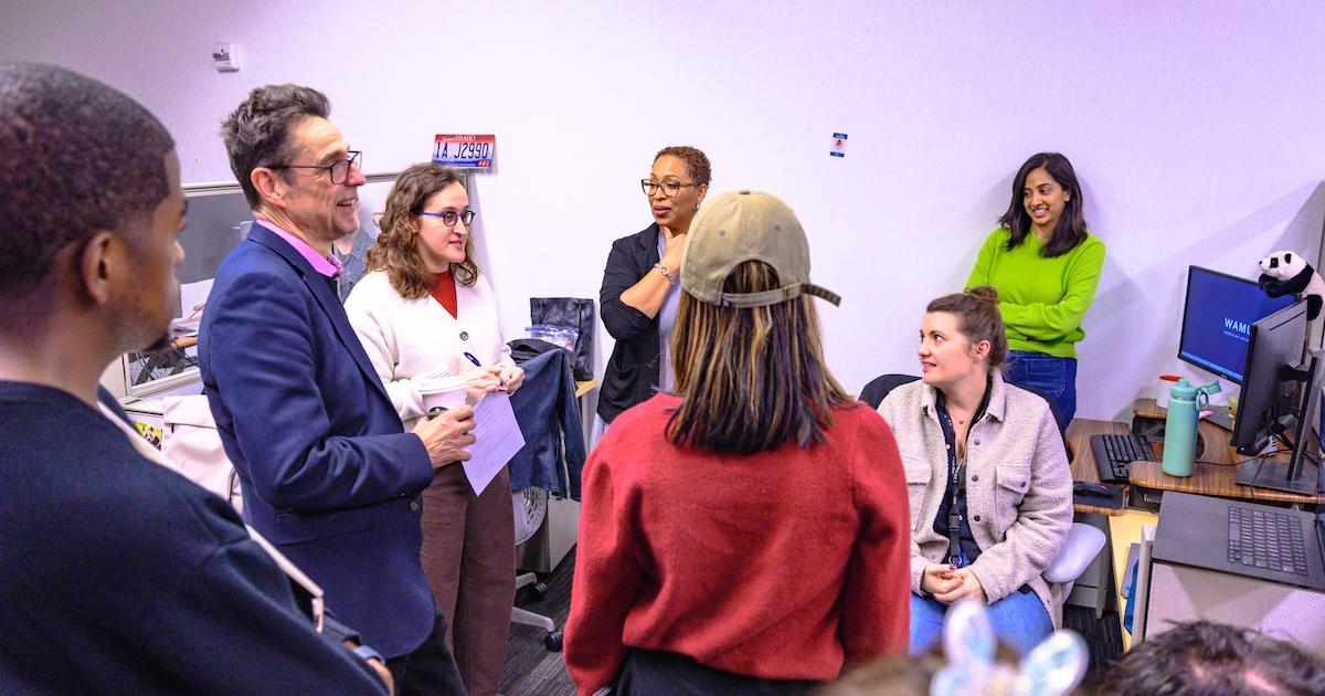 The 1A staff debriefs after its October 7 show. Photo by Jeff Watts.