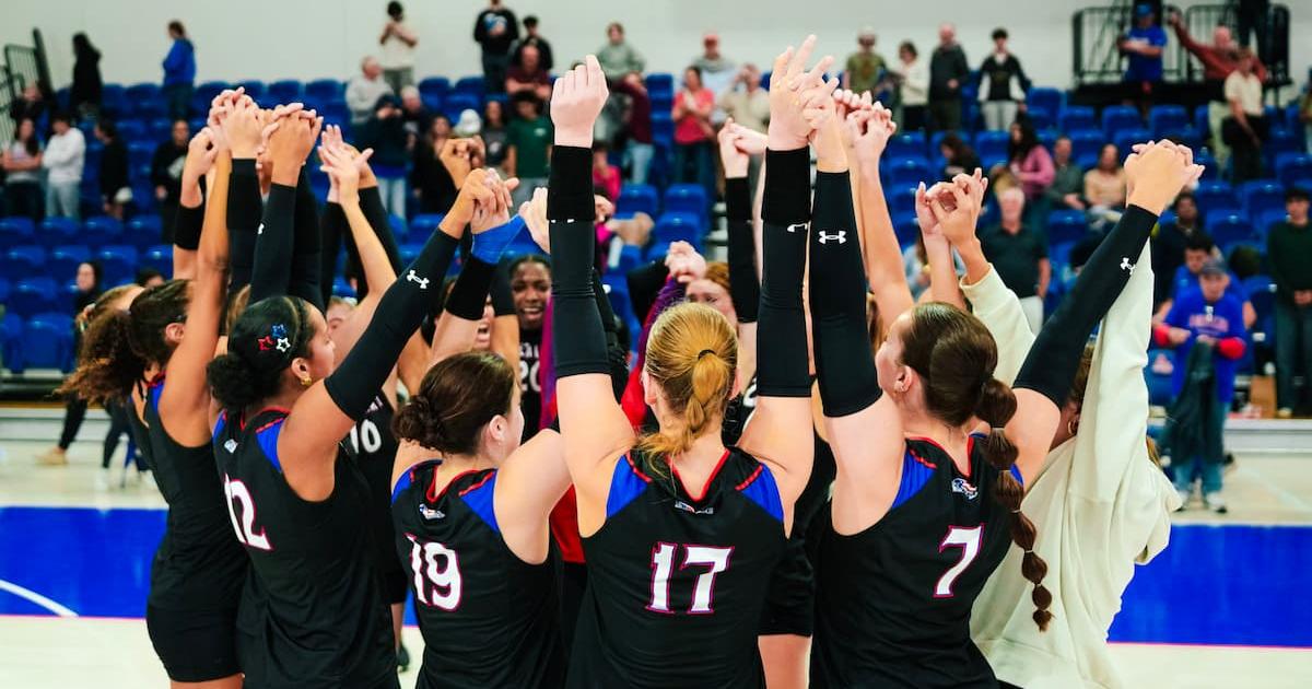 volleyball team celebrates a win