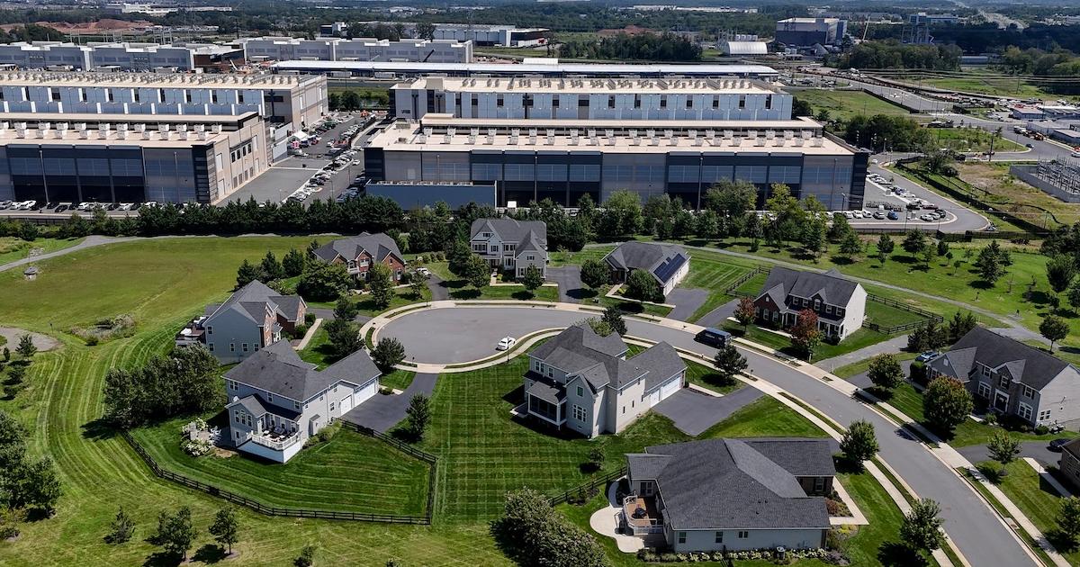 Getty Image shows data center jutting right up against a neighborhood. 