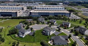 Getty Image shows data center jutting right up against a neighborhood.