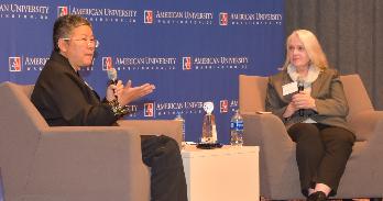 AU librarian Jee Davis, left, speaks with the National Archives' Pamela Wright.