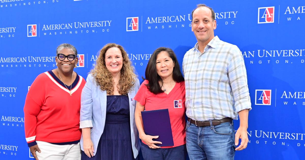 Lisa Arakaki, second from right, accepts the Maria Bueno Lifetime Achievement Award. Photo by Jeff Watts.