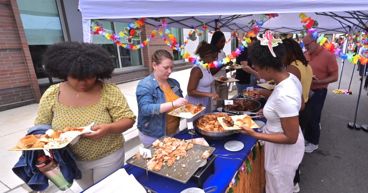Colleagues grab lunch outside the Meltzer Center at Eagle Welcome. Photo by Jeff Watts.