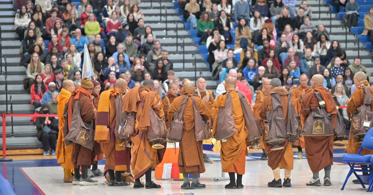 monks gather in Bender Arena
