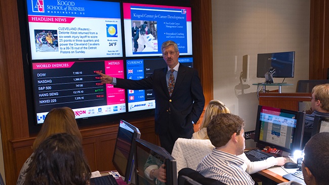 Finance professor H. Kent Baker teaches students in the Kogod Financial Lab.