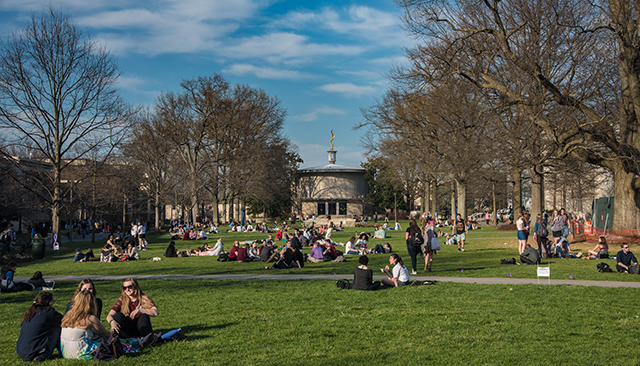 Students enjoy an early taste of spring weather on AU's main quad.