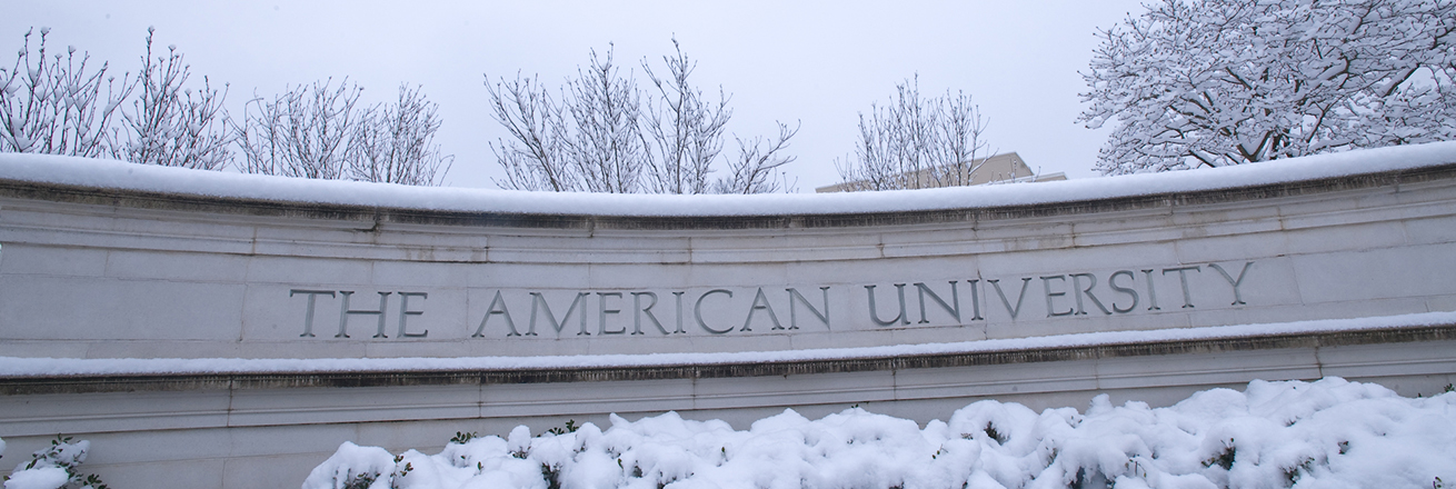 The American University gate covered in snow.