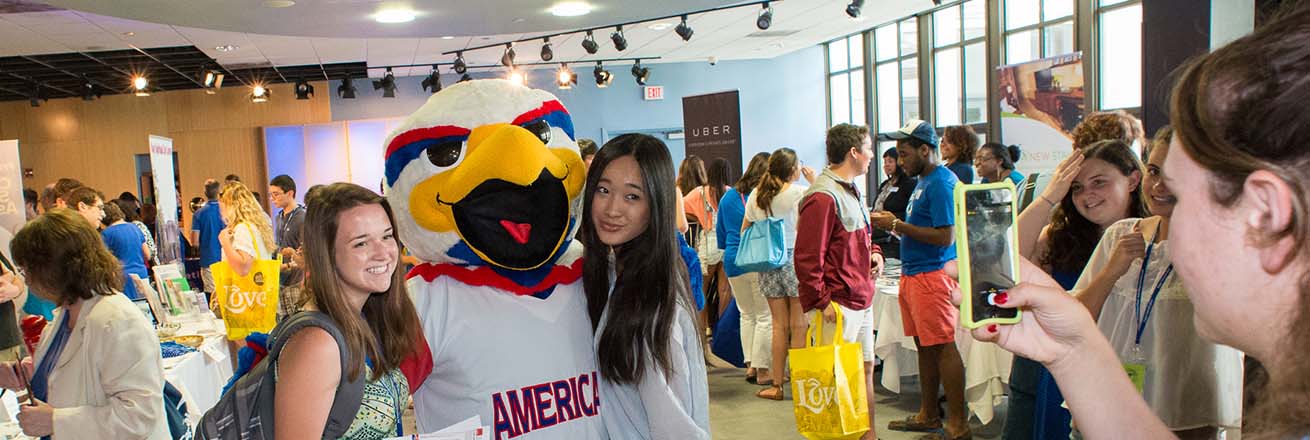 Clawed the Eagle poses with students